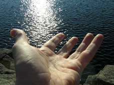 Contact, hand offers support, lake